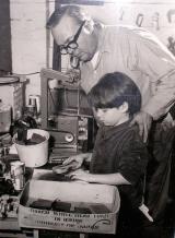 Ray Gibson instructing his young apprentice, Jon.